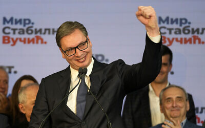 Serbian President and presidential candidate Aleksandar Vucic gestures during a news conference after claiming victory in the presidential election in Belgrade, Serbia, Sunday, April 3, 2022. Vucic and his populist right-wing party appeared headed to victory in Sunday's national election, extending a decade-long authoritarian rule in the Balkan country, according to early pollsters' projections. (AP Photo/Darko Vojinovic)