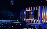 President of Ukraine, Volodymyr Zelensky, speaks on screen at the 64th Annual Grammy Awards on Sunday, April 3, 2022, in Las Vegas. (AP Photo/Chris Pizzello)