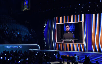 President of Ukraine, Volodymyr Zelensky, speaks on screen at the 64th Annual Grammy Awards on Sunday, April 3, 2022, in Las Vegas. (AP Photo/Chris Pizzello)
