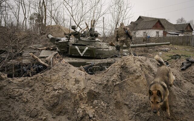 A Ukrainian serviceman walks on an abandoned Russian army tank in Andriivka, Ukraine, April 5, 2022 (AP Photo/Vadim Ghirda, File) A Ukrainian serviceman walks on an abandoned Russian army tank in Andriivka, Ukraine, April 5, 2022 (AP Photo/Vadim Ghirda, File)