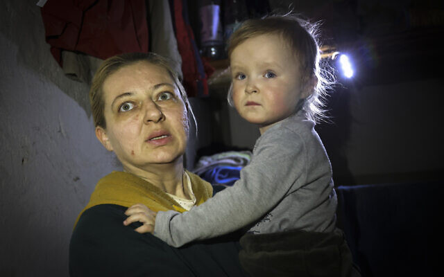 A woman holds her child as she speaks to a photographer in the basement of a building damaged during a fighting used as a bomb shelter in Mariupol, on the territory which is now under the Government of the Donetsk People's Republic control, April 8, 2022. (AP Photo/Alexei Alexandrov) A woman holds her child as she speaks to a photographer in the basement of a building damaged during a fighting used as a bomb shelter in Mariupol, on the territory which is now under the Government of the Donetsk People's Republic control, April 8, 2022. (AP Photo/Alexei Alexandrov)