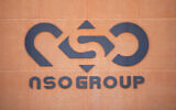 A logo adorns a wall on a branch of the Israeli NSO Group company, near the southern Israeli town of Sapir, August 24, 2021. (AP Photo/Sebastian Scheiner, File)