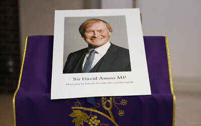 In this Friday, Oct. 15, 2021 file photo, an image of murdered British Conservative lawmaker David Amess is displayed near the altar in St Peters Catholic Church before a vigil in Leigh-on-Sea, Essex, England. (AP Photo/Alberto Pezzali, File) In this Friday, Oct. 15, 2021 file photo, an image of murdered British Conservative lawmaker David Amess is displayed near the altar in St Peters Catholic Church before a vigil in Leigh-on-Sea, Essex, England. (AP Photo/Alberto Pezzali, File)