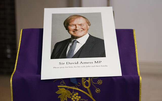 In this Friday, Oct. 15, 2021 file photo, an image of murdered British Conservative lawmaker David Amess is displayed near the altar in St Peters Catholic Church before a vigil in Leigh-on-Sea, Essex, England. (AP Photo/Alberto Pezzali, File) In this Friday, Oct. 15, 2021 file photo, an image of murdered British Conservative lawmaker David Amess is displayed near the altar in St Peters Catholic Church before a vigil in Leigh-on-Sea, Essex, England. (AP Photo/Alberto Pezzali, File)