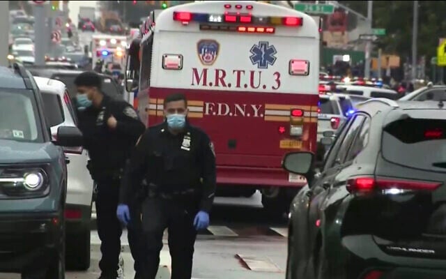 This still image provided by WABC shows law enforcement gathering at the scene of a shooting in the Brooklyn borough of New York on April 12, 2022. (WABC via AP) This still image provided by WABC shows law enforcement gathering at the scene of a shooting in the Brooklyn borough of New York on April 12, 2022. (WABC via AP)