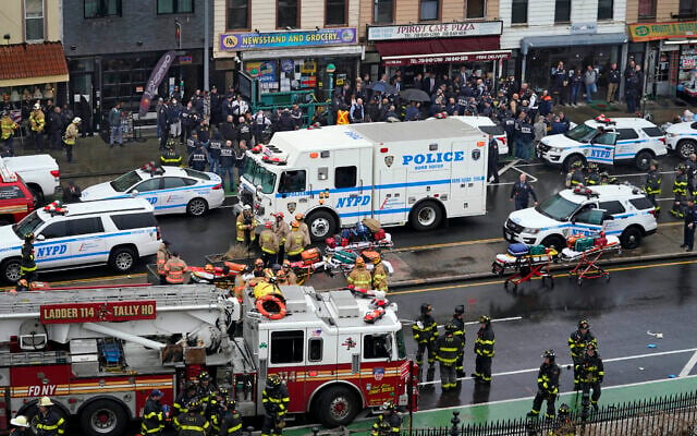 Emergency personnel gather at the entrance to a subway stop in the Brooklyn borough of New York, on April 12, 2022. (AP Photo/John Minchillo) Emergency personnel gather at the entrance to a subway stop in the Brooklyn borough of New York, on April 12, 2022. (AP Photo/John Minchillo)