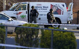 Bomb squad personnel search a moving truck during an ongoing investigation in the Brooklyn borough of New York, Tuesday, April 12, 2022. (AP/John Minchillo)