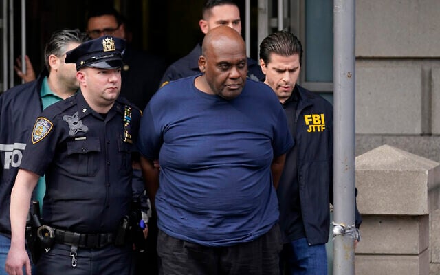 New York City Police and law enforcement officials lead subway shooting suspect Frank R. James, 62, center, away from a police station, in New York, on April 13, 2022. (AP Photo/Seth Wenig) New York City Police and law enforcement officials lead subway shooting suspect Frank R. James, 62, center, away from a police station, in New York, on April 13, 2022. (AP Photo/Seth Wenig)