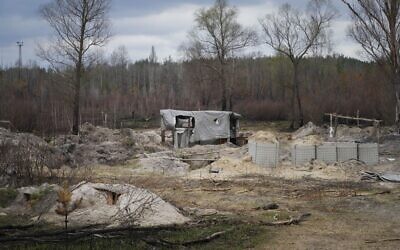 Russian trenches and firing positions in the highly radioactive Red Forest stuffed with radioactive remnants near the Chernobyl nuclear power plant in Chernobyl, Ukraine, on April 16, 2022. (AP Photo/Efrem Lukatsky)