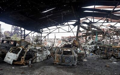 The gutted remains of vehicles are seen at the Illich Iron & Steel Works Metallurgical Plant, the second largest metallurgical enterprise in Ukraine, in an area controlled by Russian-backed separatist forces in Mariupol, Ukraine, April 16, 2022. (AP Photo/Alexei Alexandrov)