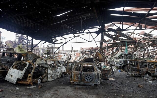 The gutted remains of vehicles are seen at the Illich Iron & Steel Works Metallurgical Plant, the second largest metallurgical enterprise in Ukraine, in an area controlled by Russian-backed separatist forces in Mariupol, Ukraine, April 16, 2022. (AP Photo/Alexei Alexandrov)