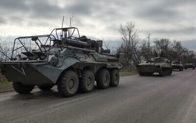A Russian military convoy moves on a highway in an area controlled by Russian-backed separatist forces near Mariupol, Ukraine, April 16, 2022. (AP Photo/Alexei Alexandrov)