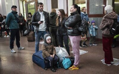 Families gather inside the train station in Lviv, Ukraine, April 17, 2022. (AP Photo/Rodrigo Abd)