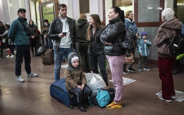 Families gather inside the train station in Lviv, Ukraine, April 17, 2022. (AP Photo/Rodrigo Abd)