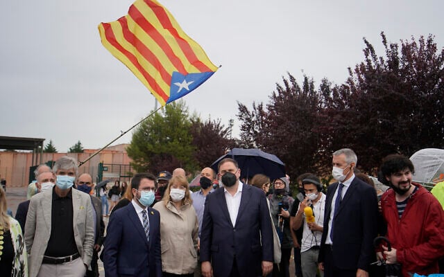 Former deputy president of the Catalan regional government Oriol Junqueras, center, walks with the current Catalonian president Pere Aragones, 2nd left, in front of an 'estelada' or Catalan pro-independence flag after being released from the Lledoners prison in Sant Joan de Vilatorrada near Barcelona, Spain, June 23, 2021. (AP Photo/ Joan Mateu, File) Former deputy president of the Catalan regional government Oriol Junqueras, center, walks with the current Catalonian president Pere Aragones, 2nd left, in front of an 'estelada' or Catalan pro-independence flag after being released from the Lledoners prison in Sant Joan de Vilatorrada near Barcelona, Spain, June 23, 2021. (AP Photo/ Joan Mateu, File)