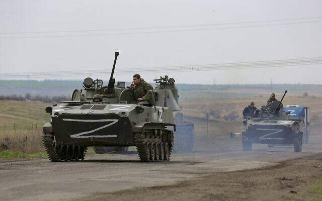Russian military vehicles move on a highway in an area controlled by Russian-backed separatist forces near Mariupol, Ukraine, on April 18, 2022. (AP Photo/Alexei Alexandrov)