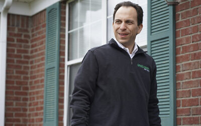 Mayoral candidate Craig Greenberg, a Democrat, prepares to knock on a door in Louisville, Ky. on Thursday, March 31, 2022. Greenberg, a Democrat, was shot at in February at a campaign office but was not struck, though a bullet grazed a piece of his clothing, police said. (AP Photo/Piper Hudspeth Blackburn)