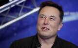 Tesla and SpaceX CEO Elon Musk arrives on the red carpet for the Axel Springer media award in Berlin on December 1, 2020. (Hannibal Hanschke/ Pool Photo via AP/ File)