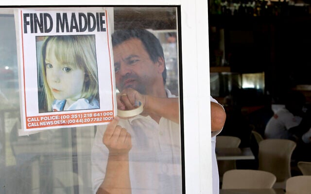 File: A waiter hangs a picture of missing Madeleine McCann on a restaurant's window, May 10 2007, in Praia da Luz, southern Portugal. (AP Photo/Armando Franca) File: A waiter hangs a picture of missing Madeleine McCann on a restaurant's window, May 10 2007, in Praia da Luz, southern Portugal. (AP Photo/Armando Franca)