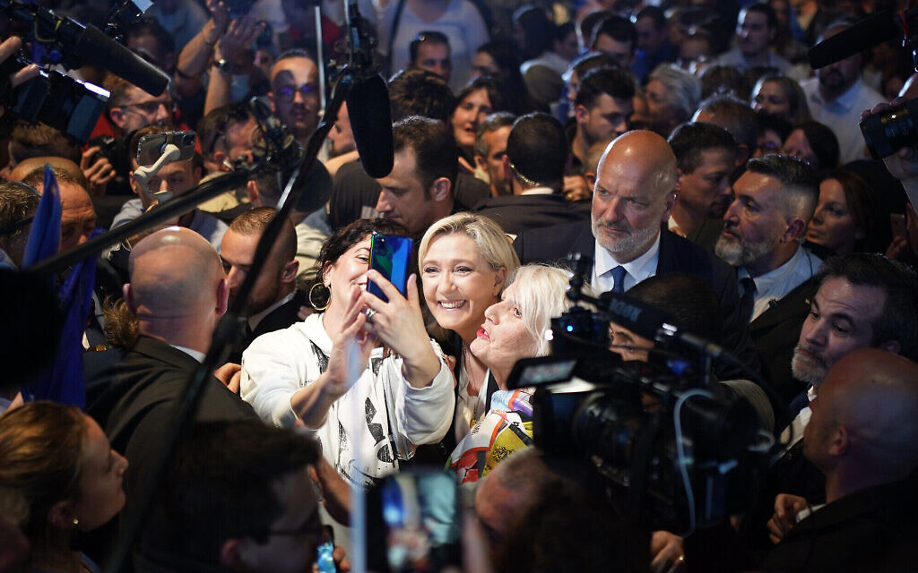 French far-right leader Marine Le Pen mobbed by supporters during a campaign rally in Perpignan, southern France, April 7, 2022. (AP Photo/Joan Mateu Parra) French far-right leader Marine Le Pen mobbed by supporters during a campaign rally in Perpignan, southern France, April 7, 2022. (AP Photo/Joan Mateu Parra)