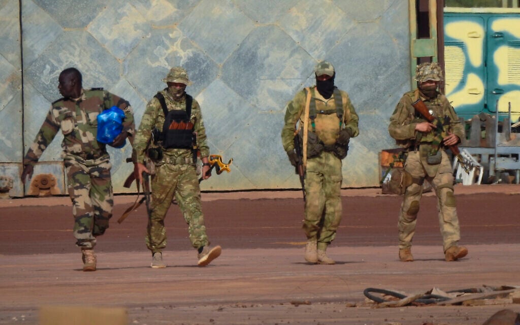 This undated photograph handed out by French military shows three Russian mercenaries, right, in northern Mali. Russia has engaged in under-the-radar military operations in at least half a dozen countries in Africa in the last five years using a shadowy mercenary force analysts say is loyal to President Vladimir Putin. The analysts say the Wagner Group of mercenaries is also key to Putin's ambitions to re-impose Russian influence on a global scale. (French Army via AP)