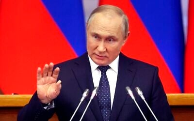 Russian President Vladimir Putin gestures while addresseing a meeting of the Council of Legislators under the Russian Federal Assembly at the Tauride Palace, in St. Petersburg, Russia on April 27, 2022. (Alexander Demyanchuk, Sputnik, Kremlin Pool Photo via AP)