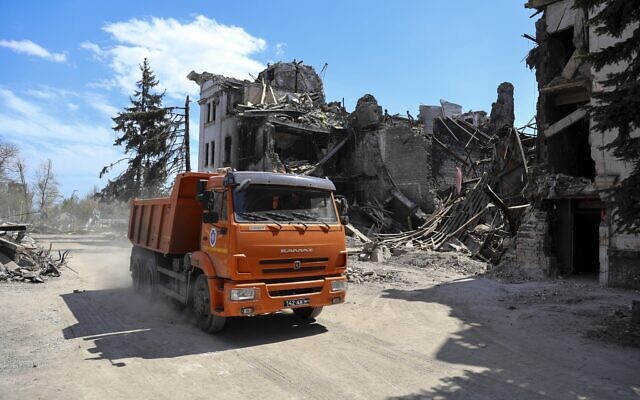 A truck drives past the Mariupol theater damaged during fighting in Mariupol, in territory under the government of the Donetsk People's Republic, eastern Ukraine, April 27, 2022. Municipal services began clearing rubble and cleaning the city. (AP Photo/Alexei Alexandrov) A truck drives past the Mariupol theater damaged during fighting in Mariupol, in territory under the government of the Donetsk People's Republic, eastern Ukraine, April 27, 2022. Municipal services began clearing rubble and cleaning the city. (AP Photo/Alexei Alexandrov)