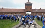 Visitors to the Auschwitz Nazi concentration camp after the March of the Living annual observance, in Oswiecim, Poland, April 28, 2022. (Czarek Sokolowski/AP)