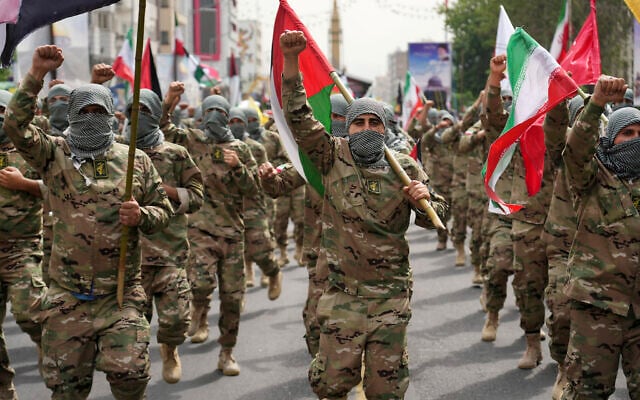 Basij paramilitary force members march during the annual pro-Palestinian Al-Quds, or Jerusalem, Day rally as they cover their faces in the style of Palestinian and Lebanese terrorists in Tehran, Iran, April 29, 2022. (AP/Vahid Salemi) Basij paramilitary force members march during the annual pro-Palestinian Al-Quds, or Jerusalem, Day rally as they cover their faces in the style of Palestinian and Lebanese terrorists in Tehran, Iran, April 29, 2022. (AP/Vahid Salemi)