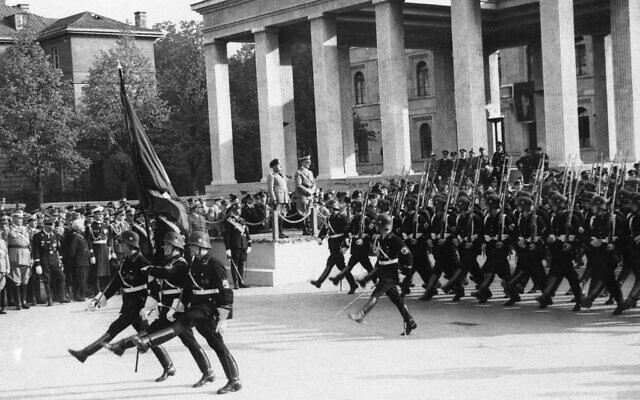 Italy's Benito Mussolini and Germany's Adolf Hitler review troops on parade, Sept. 26, 1937. (AP Photo) Italy's Benito Mussolini and Germany's Adolf Hitler review troops on parade, Sept. 26, 1937. (AP Photo)