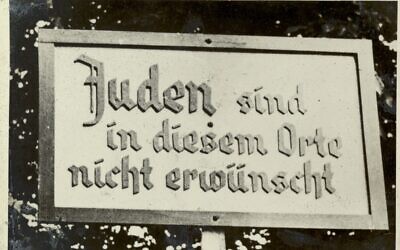 An antisemitic sign photographed in Germany, circa 1935, reading, 'Jews are not welcome here.' (From the Motorcycle Album, courtesy Wiener Holocaust Library collections)