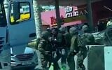 IDF soldiers allegedly assaulting an Israeli-Arab truck driver in the Palestinian village of Hizma near Jerusalem. (Screenshot; in accordance with clause 27a of the Copyright Law)