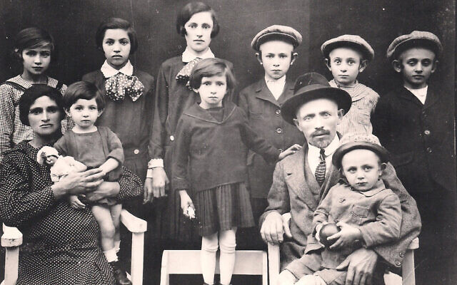 Czik family in Ujfeherto, Hungary pre-WWII. Olga Czik sits on lap of her mother, who is pregnant with family's tenth and final child Eva. (Courtesy of Olga Czik Kay)