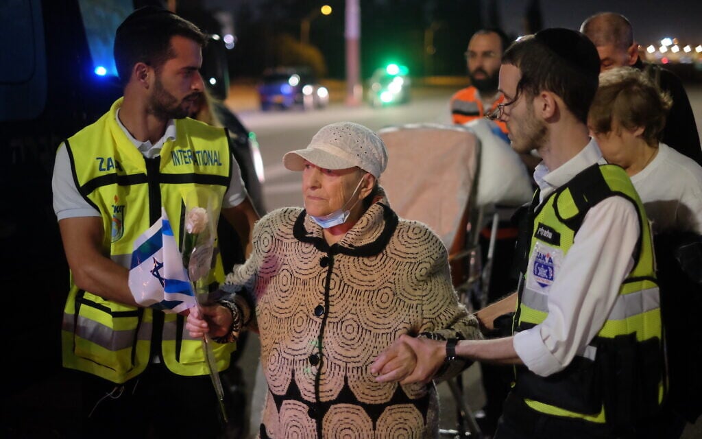 A Ukrainian Holocaust survivor and refugee, Sofia Trizna, is helped into an ambulance after she disembarked a special medical transport plane that landed at Ben Gurion Airport on April 27, 2022. (Judah Ari Gross/Times of Israel)