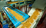 A factory producing Bamba in Sderot on May 8, 2014. (Moshe Shai/Flash90)