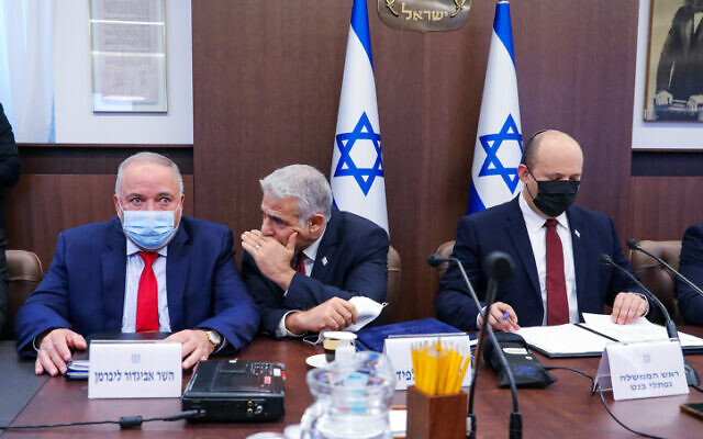 Prime Minister Naftali Bennett, right, Foreign Minister Yair Lapid, center and Finance Minister Avigdor Liberman during a cabinet meeting at the Prime Minister's office in Jerusalem, on November 7, 2021. (Marc Israel Sellem/Pool) Prime Minister Naftali Bennett, right, Foreign Minister Yair Lapid, center and Finance Minister Avigdor Liberman during a cabinet meeting at the Prime Minister's office in Jerusalem, on November 7, 2021. (Marc Israel Sellem/Pool)