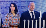 Israeli Prime Minister Naftali Bennett and his wife Gilat attend a ceremony on the second night of the Jewish holiday of Hanukkah, at the Nativ program on the Kiryat Moriah campus in Jerusalem, November 29, 2021. (Olivier Fitoussi/Flash90)