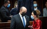 Prime Minister Naftali Bennett (left) with MK Idit Silman at the Knesset in Jerusalem, January 5, 2022 (Yonatan Sindel/Flash90)