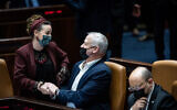 Minister of Defense Benny Gantz with MK Idit Silman during a plenum session at the Knesset, February 28, 2022.  (Yonatan Sindel/Flash90)