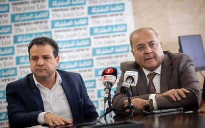 MK Ayman Odeh (left), head of the Joint List, and MK Ahmad Tibi attend a faction meeting at the Knesset in Jerusalem on March 7, 2022. (Yonatan Sindel/Flash90)