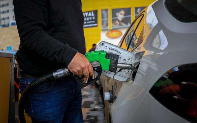 A man fills up his car at a gas station in Jerusalem, March 11, 2022. (Jamal Awad/Flash90) A man fills up his car at a gas station in Jerusalem, March 11, 2022. (Jamal Awad/Flash90)