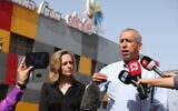 Health Ministry Director-General Nachman Ash and Head of Public Health Services Sharon Alroy-Preis speaking to the press during a visit to the Strauss Elit candy factory in Nof Hagalil, Northern Israel, on April 28, 2022. (David Cohen/Flash90)