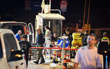 Israeli security and rescue personnel at the scene of a shooting attack, at the entrance to Ariel, in the West Bank, on April 30, 2022. (Flash90)