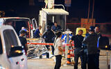 Israeli security and rescue personnel at the scene of a shooting attack, at the entrance to Ariel, in the West Bank, on April 30, 2022. (Flash90)
