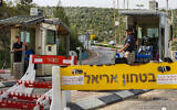 Security guards at the entrance to Ariel, April 30, 2022, where Palestinian terrorists shot and killed a security guard a day earlier (Flash90)