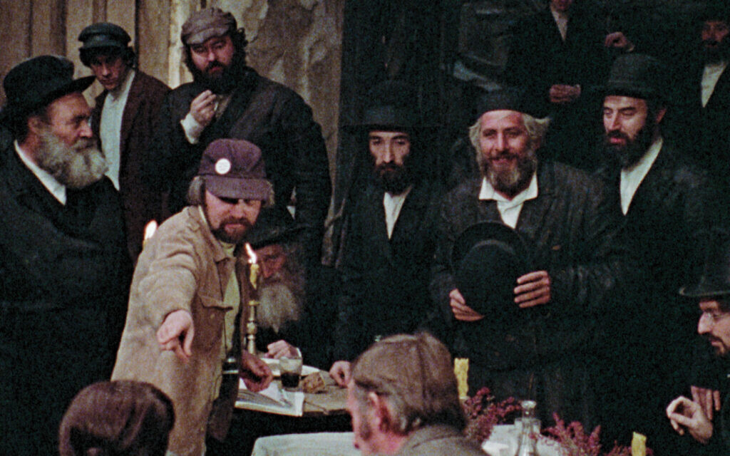 Norman Jewison (in baseball cap) directs on set of 1971 film 'Fiddler on the  Roof.' Chaim Topol, who played Tevye, is second from right. (Courtesy of Zeitgeist Films)