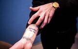 EasyJet apologizes after sharing this picture of a passenger who tattooed the details of a first flight with the airline (via Twitter)