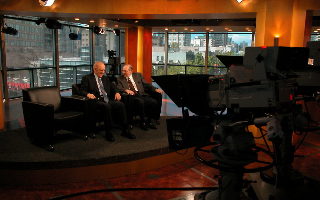 Kalman Bar-on, left, and Leopold Lowy on Canadian news in 2002. (Courtesy Richard Lowy)