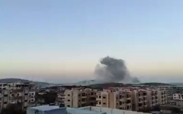 A cloud of smoke rises after an alleged airstrike near the Syrian city of Masyaf, on April 9, 2022. (Screenshot/Twitter) A cloud of smoke rises after an alleged airstrike near the Syrian city of Masyaf, on April 9, 2022. (Screenshot/Twitter)