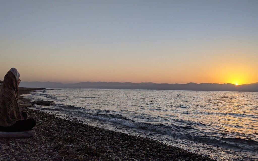 The sun rises over Saudi Arabia across the water from Ras Shaitan, Sinai on November 7, 2021. (Melanie Lidman/Times of Israel)